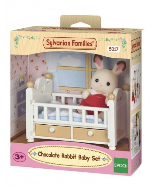 Bébé lapin chocolat et le lit